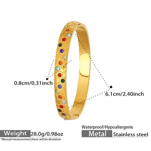 Detail view showing a gold stainless steel honeycomb bangle with colorful zircon stones