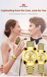 Detail view of gold-plated couple's quartz watches with sparkling crystal markers