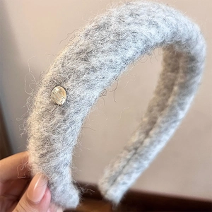 Gray plush headband with silver metal button detail for autumn and winter style
