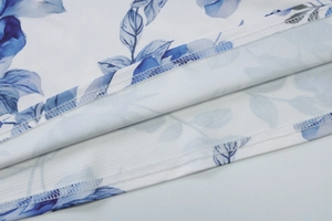 Detail shot of blue floral print fabric showing high-quality stitching and seam work