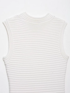 Close-up of white ribbed knit sleeveless top showing horizontal texture and elastic fabric