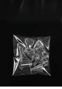 Macro shot of miniature clear plastic cups for DIY crafts in transparent packaging