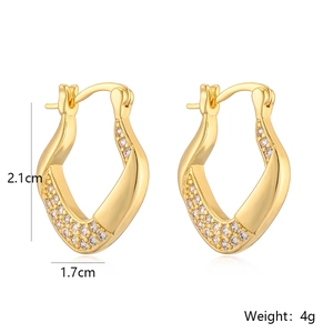 Detail view of twisted gold-plated heart earrings with zircon inlay and size measurements