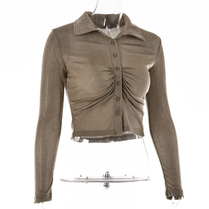 Detail of khaki sheer mesh shirt featuring front pleats and stylish pointed collar design