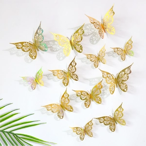 Detailed view of 3D hollow golden butterfly wall stickers with realistic shadows on wall