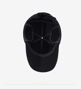 Detail of the inner lining and ear flaps on this warm black winter baseball cap