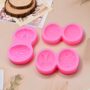 Detailed macro view of pink silicone Easter molds with rabbit and floral patterns for DIY baking