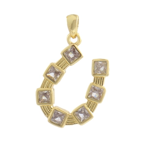 Detailed view of a gold-plated horseshoe pendant set with clear square-cut crystals