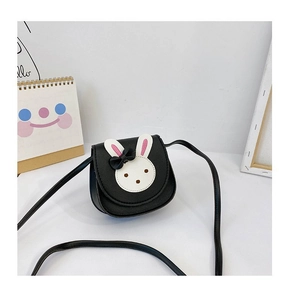 Close-up of kids black crossbody bag with cute white bunny face and bow detail