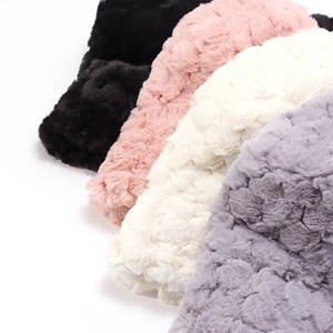 Plush faux fur bucket hats in black, pink, cream, and grey for winter warmth