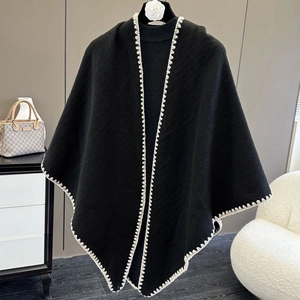 Elegant black knitted cape shawl with white zigzag stitching for winter office wear