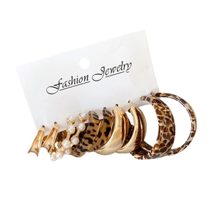 Golden acrylic leopard print and pearl earring set on a fashion jewelry display card