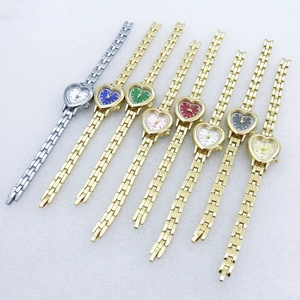 Detailed collection of eight heart-shaped quartz watches with rhinestone bezels in assorted colors