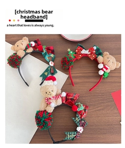 Detailed view of three plush Christmas bear headbands with festive bows and tiny hats
