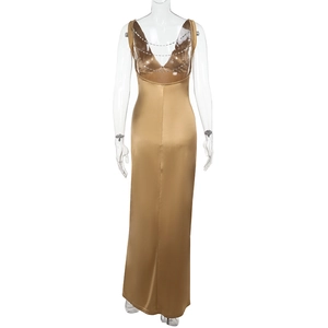 Close-up of gold satin evening dress featuring backless deep V-cut and tiered crystal beads