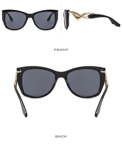 Details einer Schmetterlings-Sonnenbrille mit schwarzem Rahmen und goldenen Bügeln