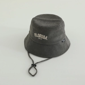Detail of dark grey corduroy kids bucket hat showing Florida 1845 embroidery and chin strap