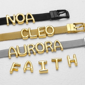 Customizable mesh strap bracelet with gold alphabet letters in black, gold, and silver finishes