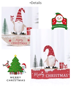 Detail of Christmas wooden gnome ornaments with striped hats and Merry Christmas text