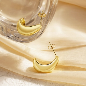 Elegant gold-tone C-shaped croissant hoop earrings with a polished finish for women