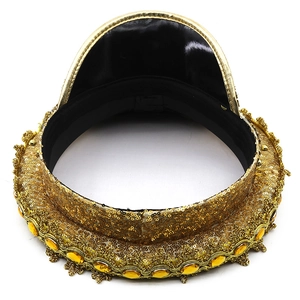 Detailed top view of gold sequined military hat with yellow gemstone and lace trim