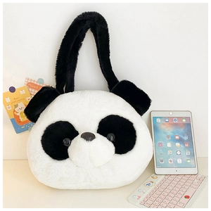Macro detail of the soft black and white plush panda bag texture and thick shoulder strap