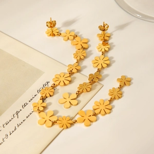 Detailed close-up of 18K gold-plated stainless steel daisy flower drop earrings