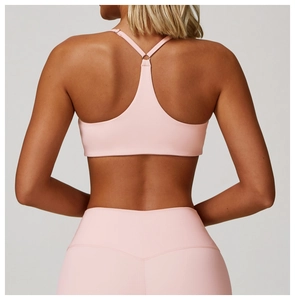Detailed back view of pink Y-back yoga bra and high-waist leggings with soft texture