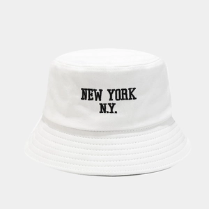 Close-up of white cotton bucket hat featuring black NEW YORK N.Y. embroidery detail