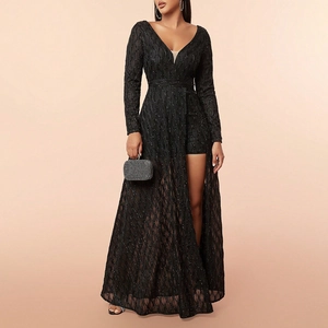 Detail of elegant black sequin evening gown featuring deep V-neck and high leg slit