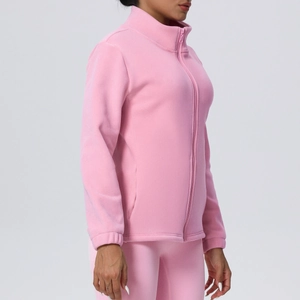 Detail of pink fleece jacket with full zipper and stand-up collar for winter sports