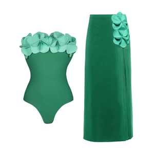 Detail of 3D floral accents on green tube bodysuit and matching side-slit sarong set