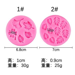 Pink silicone fondant mold featuring maple and ginkgo leaf shapes for cake decorating