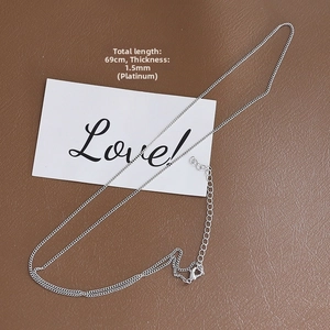 Detail of 1.5mm white gold plated flat cable chain necklace with lobster clasp