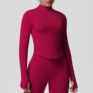 Detail of burgundy ribbed seamless sports jacket showing stand collar and zip closure