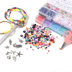 DIY jewelry kit with 24 compartments of glass beads, letter charms and metal pendants
