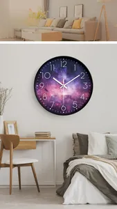 Detailed view of creative silent wall clock featuring a purple nebula galaxy pattern dial