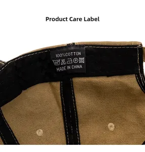 Detailed close-up of the care label and cotton fabric inside the khaki baseball cap
