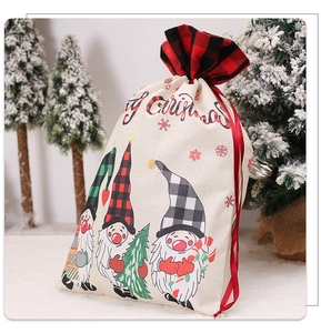 Close-up of Merry Christmas drawstring gift bag with cartoon forest gnome on snow background