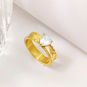 Luxury gold titanium steel heart ring with white zircon and textured band on white background