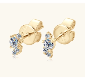 Detail of S925 sterling silver gold earrings with three graduated moissanite stones