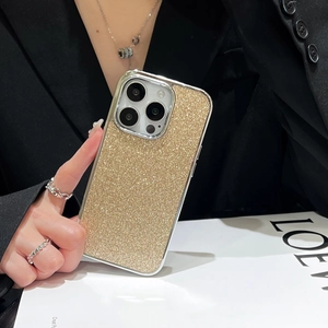 Chic gold glitter phone case with metallic frame held by model for iPhone 15 Pro