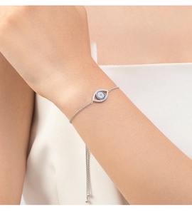 Close-up of s925 silver Evil Eye bracelet with blue stones and adjustable slide clasp