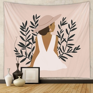 Detail of minimalist bohemian wall tapestry featuring a woman in a backless dress illustration