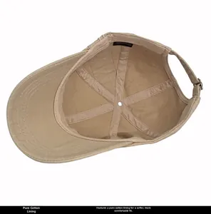 Detail view of khaki cotton baseball cap interior with 100% cotton label and silver buckle