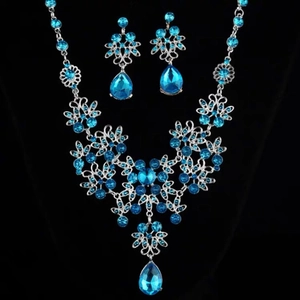 Luxury silver flower necklace and teardrop earring set with blue rhinestones