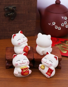 Set of four mini resin Maneki Neko cat figurines for office desk and car dashboard decor
