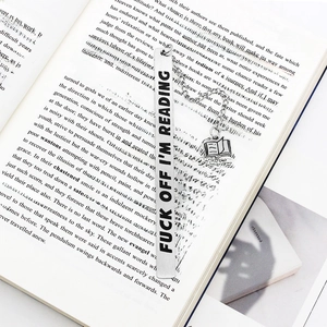 Silver stainless steel bookmark with book pendant shown used in an open book