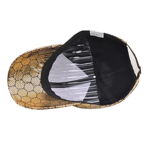 Unisex baseball cap with gold metallic honeycomb texture and white cotton inner label