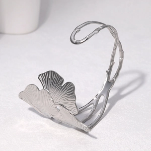 Elegant silver ginkgo leaf open bangle in stainless steel with detailed vein textures